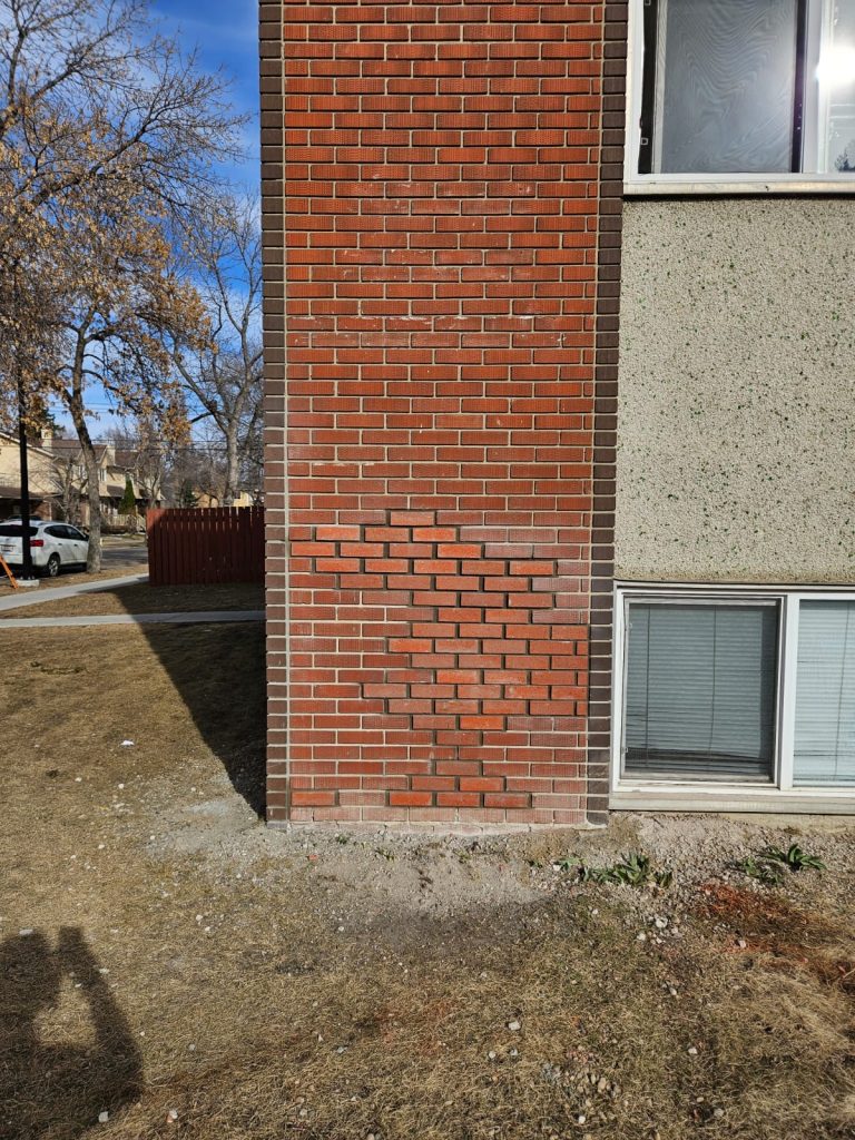 Brick repair and repointing at an exterior building corner